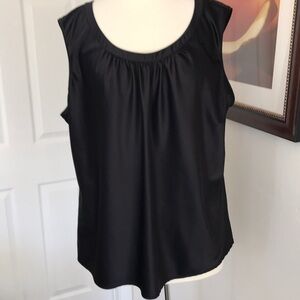 Satiny black top with a bit of stretchy.